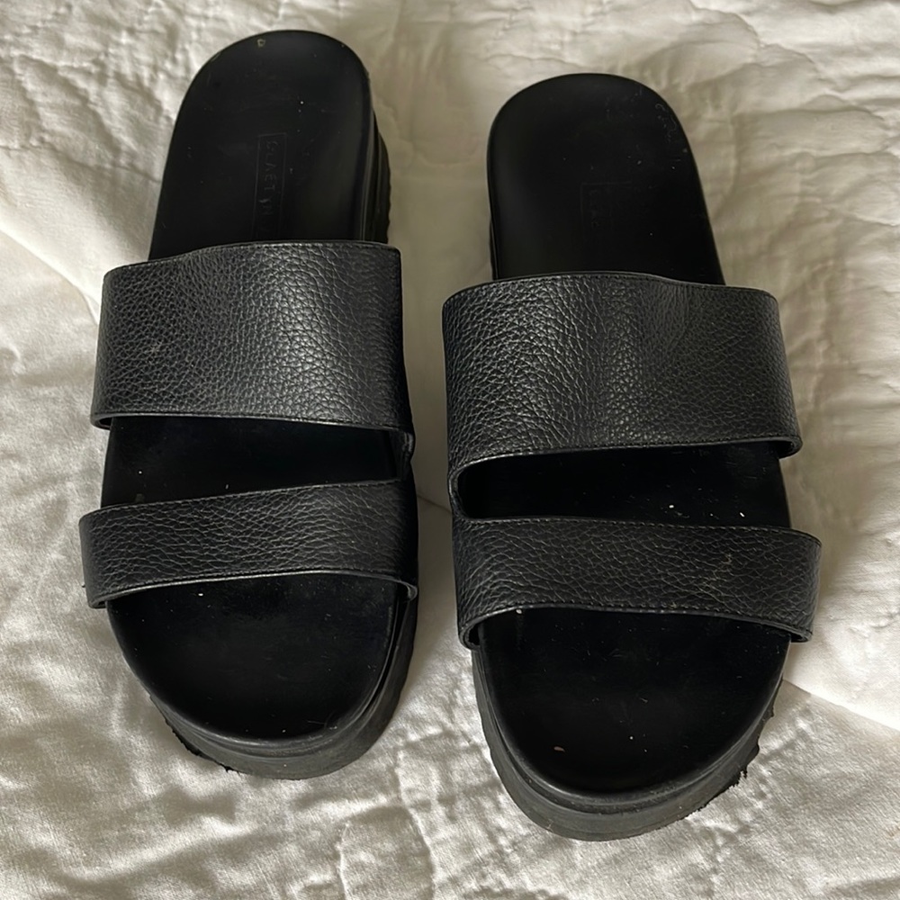 Black leather slides by Claetyn Wood size 8